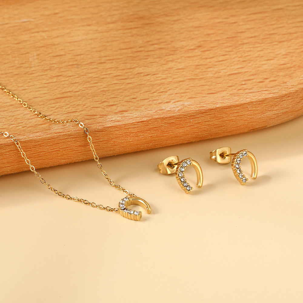Ensemble de bijoux porte-bonheur : collier et boucles d'oreilles fer à cheval