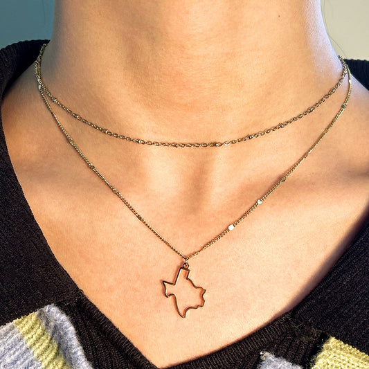 « Le charme de l'étoile solitaire : collier à pendentif double Texas »